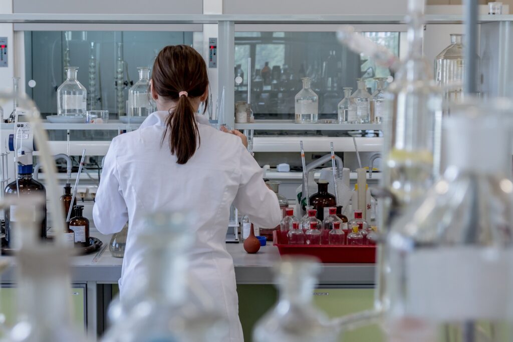 Lady in white coat working in a lab